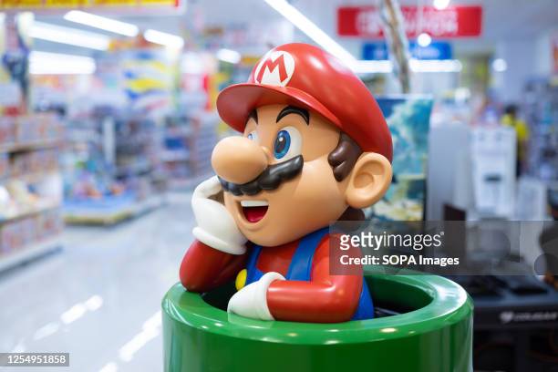 Nintendo's Super Mario figurine at a toy store entrance in Yokohama. A recently released animated film called The Super Marios Bros. Movie has...