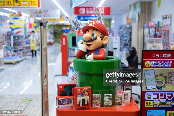 Nintendo's Super Mario figurine at a toy store entrance in Yokohama. A recently released animated film called The Super Marios Bros. Movie has...