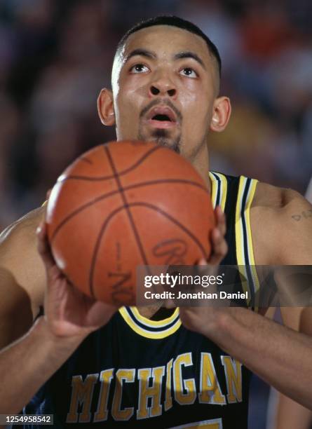 Juwan Howard Center for the University of Michigan Wolverines prepares to make a free throw during the NCAA Big 10 Conference college basketball game...