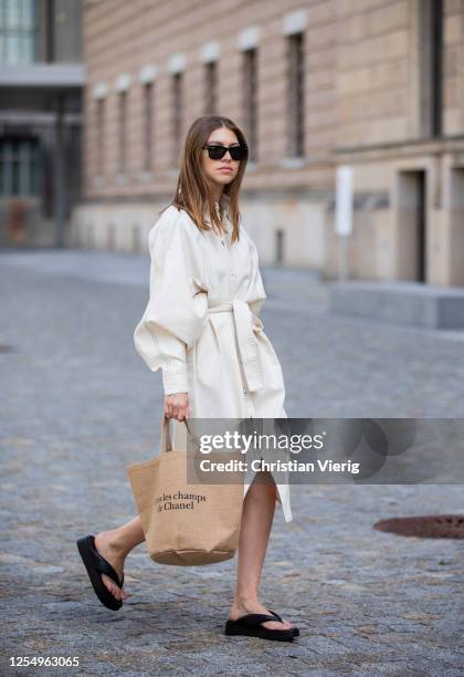 Swantje Soemmer is seen wearing white dress Blanche, Rayban sunglasses, Arket plateau flip flops, Chanel beach bag on July 07, 2020 in Berlin,...