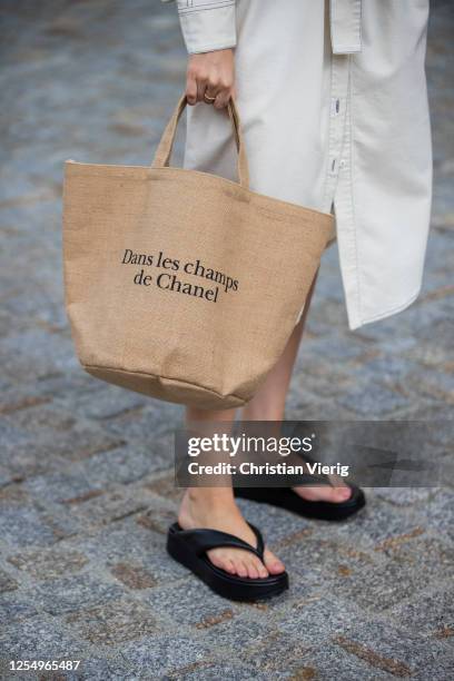 Swantje Soemmer is seen wearing white dress Blanche, Arket plateau flip flops, Chanel beach bag on July 07, 2020 in Berlin, Germany.