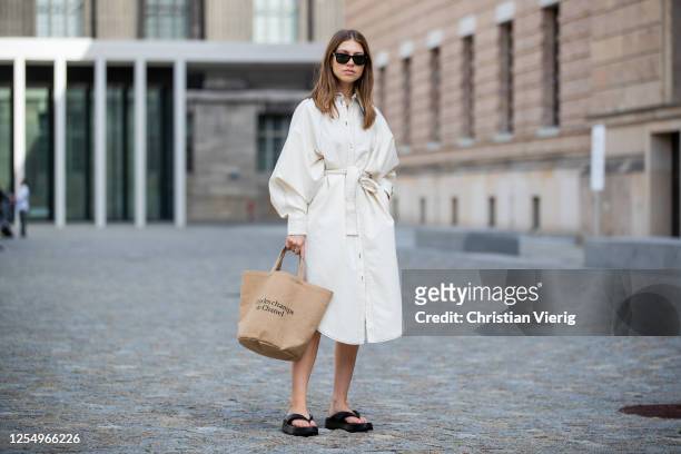 Swantje Soemmer is seen wearing white dress Blanche, Rayban sunglasses, Arket plateau flip flops, Chanel beach bag on July 07, 2020 in Berlin,...