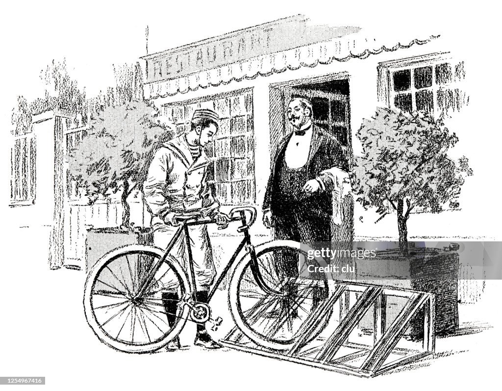 Man parkes his bike on the bike rack of the restaurant