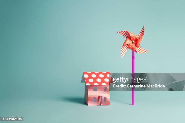 paper home and paper windmill - catherine macbride stock pictures, royalty-free photos & images
