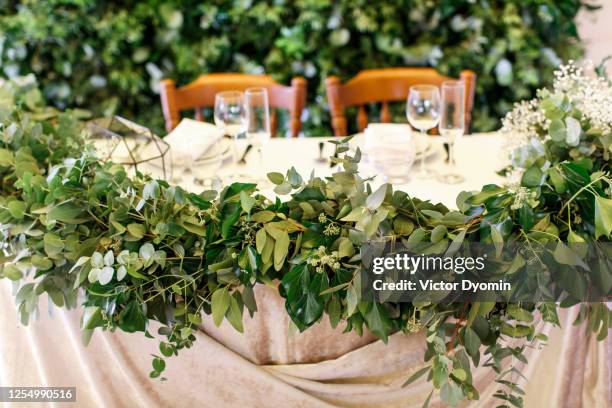 evergreen decorations for the bride and groom - wedding ceremony guests stock pictures, royalty-free photos & images