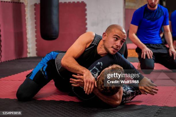 brazilian jiu jitsu bjj private class professor stock photo - jiu-jitsu stock pictures, royalty-free photos & images