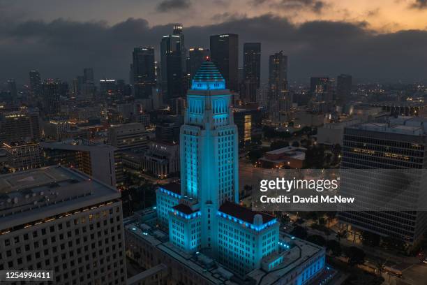 In an aerial view, Los Angeles City Hall is illuminated with blue light to commemorate the 25th anniversary of the death of Frank Sinatra on May 14,...