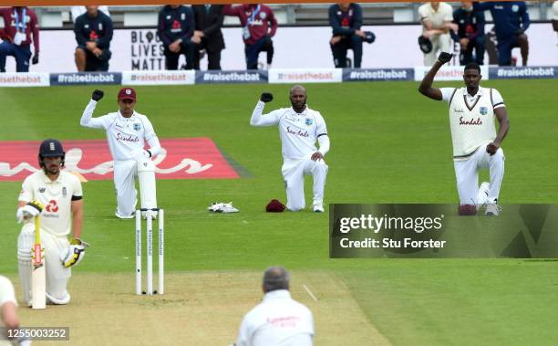 Shane Dowrich, Jermaine Blackwood and Jason Holder of the West Indies take a knee during day one of the 1st #RaiseTheBat Test match at The Ageas Bowl...