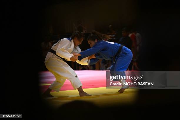 Philippines' Leah Jhane Rodriguez Lopez and Vietnam's Hoang Thi Tinh compete in the women's judo -48kg final event during the 32nd Southeast Asian...