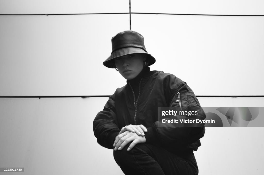 Black and white outdoor portrait of the stylish girl