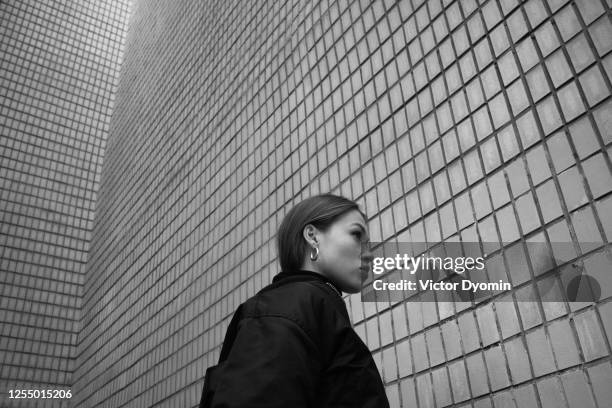 outdoor black and white portrait of the young woman - black and white city stock pictures, royalty-free photos & images