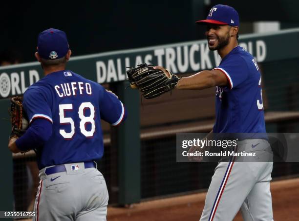 Nick Ciuffo and Yadiel Rivera of the Texas Rangers during Major League Baseball summer workouts at Globe Life Field on July 07, 2020 in Arlington,...