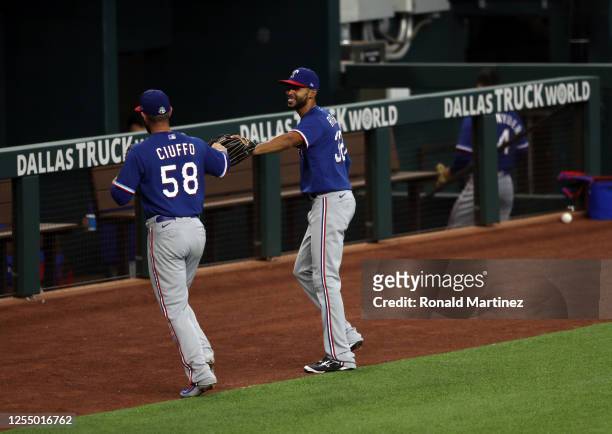 Nick Ciuffo and Yadiel Rivera of the Texas Rangers during Major League Baseball summer workouts at Globe Life Field on July 07, 2020 in Arlington,...