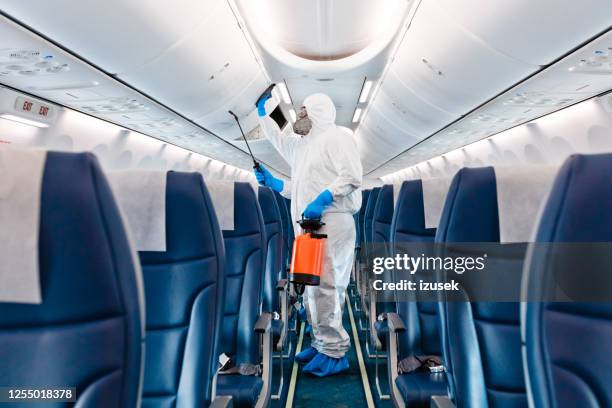 airplane disinfection due to covid-19 - covid airplanes stock pictures, royalty-free photos & images