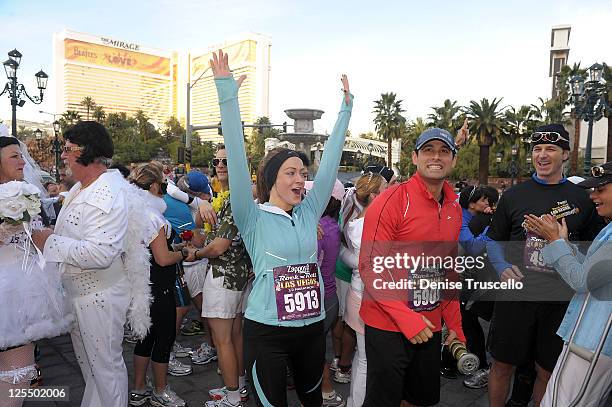 Jason Mesnick and Molly Mesnick renew their wedding vows during the Zappos.com Rock 'n' Roll Las Vegas Marathon and Half-Marathon to benefit the...