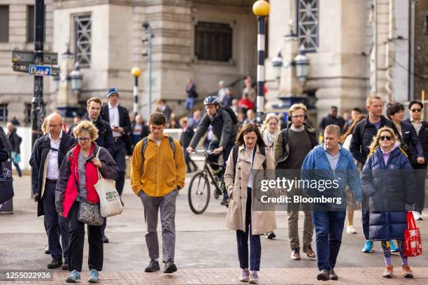 Commuters exit London Waterloo railway station after arriving in London, UK, on Monday, May 15, 2023. The upcoming batch of jobs data, due on...