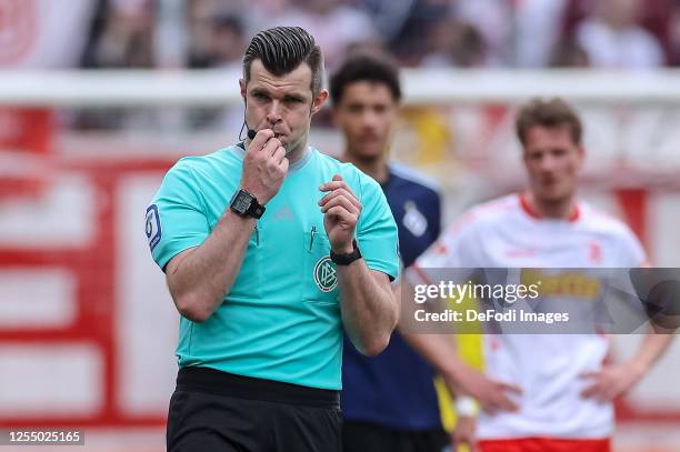 Referee Alexander Sather looks on during the Second Bundesliga match between SSV Jahn Regensburg and Hamburger SV at Jahnstadion on May 14, 2023 in...