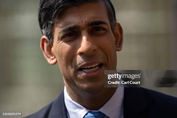 Britain's Prime Minister, Rishi Sunak, speaks during a press conference with Ukraine's President, Volodymyr Zelenskyy, in the garden at Chequers on...