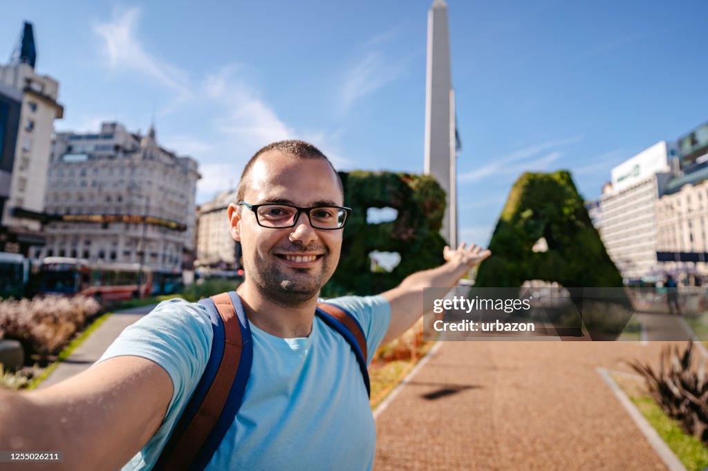 Man making selfie with Buenos Aires obelisk