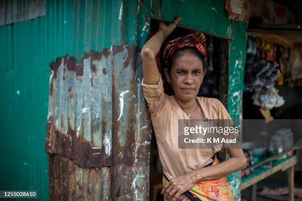 Rohingya refugee woman in front of her shop at noya para Rohingya refugee camp in Teknaf after Cyclone Mocha'a landfall.