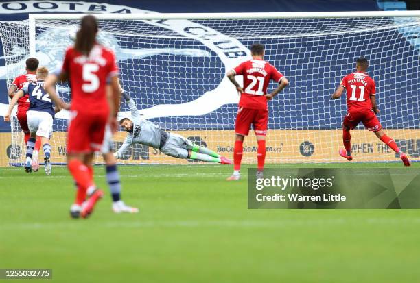 Ashley Fletcher of Middlesbrough scores his team's second goal with a penalty against goalkeeper Bartosz Bialkowski of Millwall during the Sky Bet...