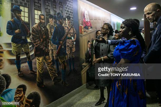 Colombia Vice President Francia Marquez pauses alongside Kenya's Chief Justice, Martha Koome to look at a mural depicting the arrest of Jomo...