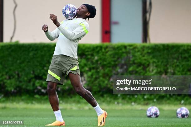 Milan's Portuguese forward Rafael Leao chest controls the ball during a training session on May 15, 2023 at the Milanello Sports Center in Carnago,...