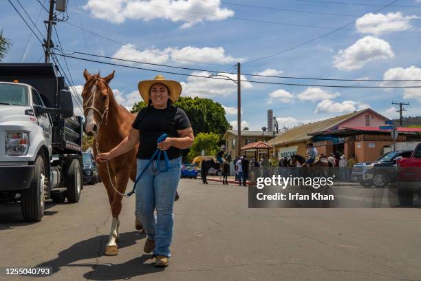 Jazmin Angel takes her horse Boots for a walk to nearby San Gabriel River eastern banks trail. Behind residents from equestrian communities across...