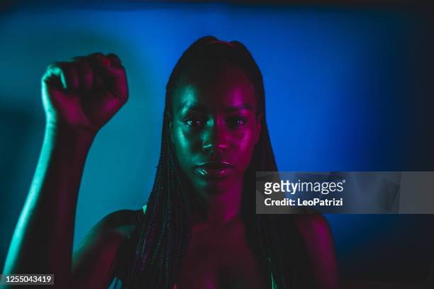woman posing for civili rights - black lives matter stock pictures, royalty-free photos & images