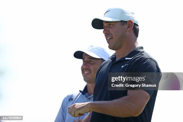 Brooks Koepka and Chase Koepka of the United States on a tee during a practice round for the Workday Charity Open at Muirfield Village Golf Club on...