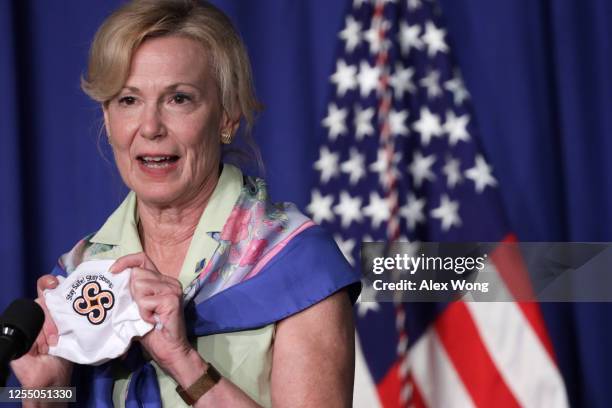 White House coronavirus response coordinator Deborah Birx holds up a mask as she speaks during a White House Coronavirus Task Force press briefing at...