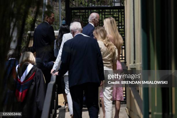 President Joe Biden walks into the Vietnam Cafe with friends and family after attending the University of Pennsylvania commencement ceremony in...