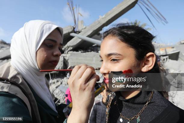 Volunteers dressed up as clowns entertain children traumatized by conflicts between the Israeli military and Palestinian resistance groups in Gaza,...