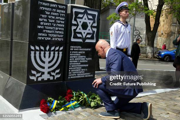 Odesa City Head Hennadii Trukhanov lays flowers at the Road of Death monument commemorating the Holocaust victims in repaired Prokhorivskyi Square,...