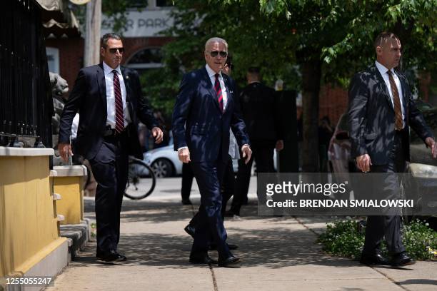 President Joe Biden leaves following a lunch with friends and family at the Vietnam Cafe, after attending the University of Pennsylvania commencement...