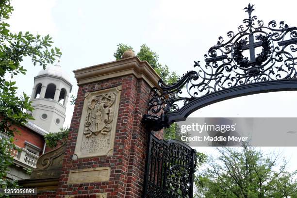 View of a gate to Harvard Yard on the campus of Harvard University on July 08, 2020 in Cambridge, Massachusetts. Harvard and Massachusetts Institute...