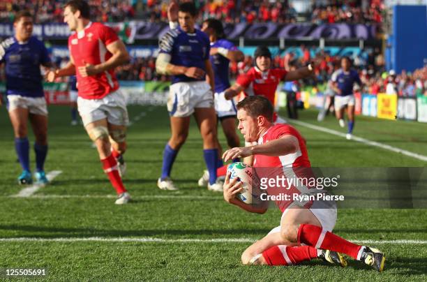 Shane Williams of Wales goes over to score their first try during the IRB 2011 Rugby World Cup Pool D match between Wales and Samoa at Waikato...