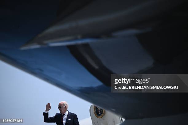 President Joe Biden waves while boarding Air Force One at Philadelphia International Airport in Philadelphia, Pennsylvania, on May 15 as they travel...