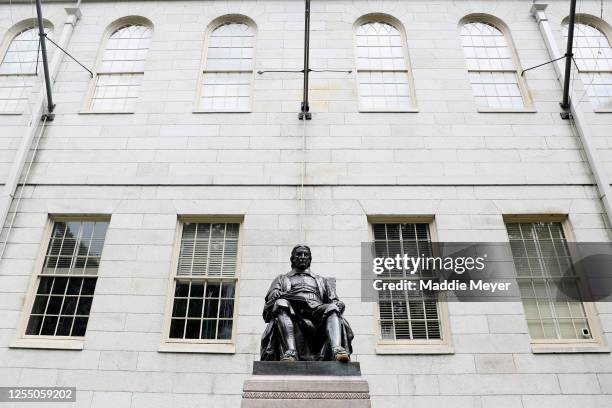 View of the statue of John Harvard on the campus of Harvard University on July 08, 2020 in Cambridge, Massachusetts. Harvard and Massachusetts...