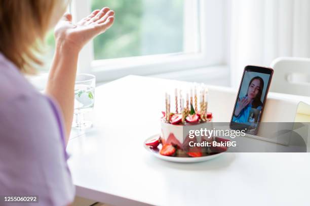 video call with family  during pandemic crisis - blowing a kiss stock pictures, royalty-free photos & images