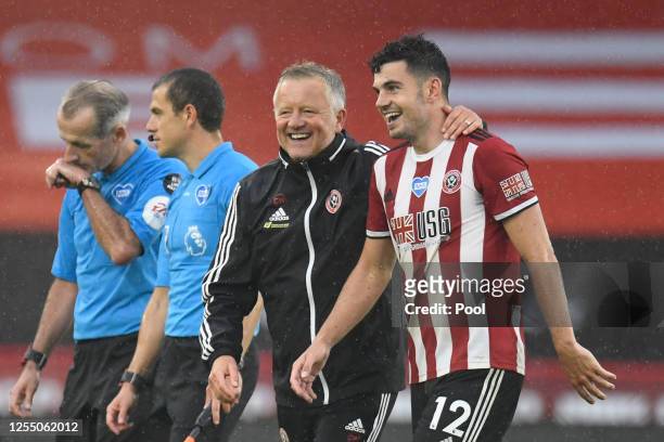 Chris Wilder, Manager of Sheffield United celebrates with John Egan of Sheffield United after the Premier League match between Sheffield United and...