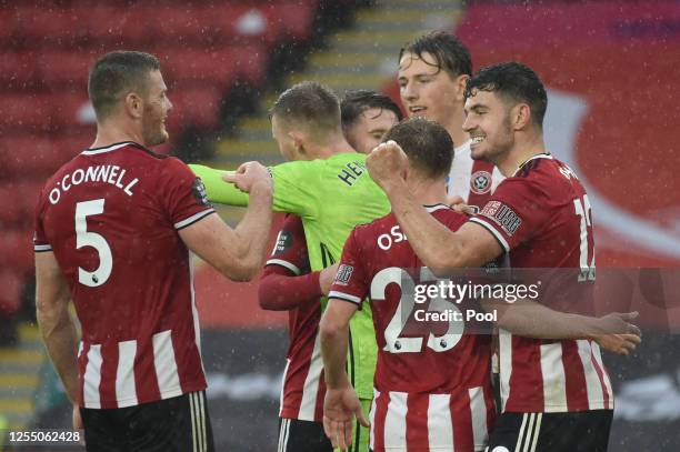 John Egan of Sheffield United celebrates after scoring his teams first goal during the Premier League match between Sheffield United and...