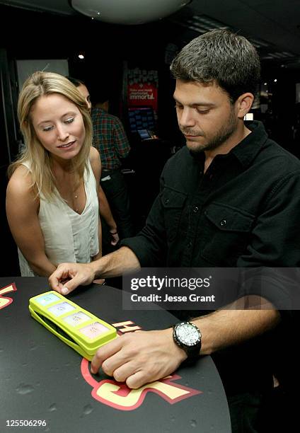 Alexandra Blodgett and actor Jerry Ferrara attend The HP Touchsmart Gift Lounge backstage at the Nokia Theatre, in celebration of The 63rd Primetime...