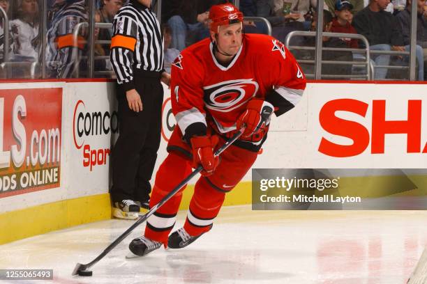 Aaron Ward of the Carolina Hurricanes skates with the puck during a NHL hockey game against the Washington Capitals at MCI Center on December 1, 2001...