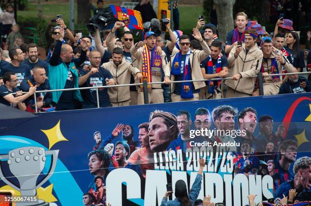 The players of FC Barcelona football team on open-top bus leave Camp Nou Stadium to celebrate La Liga title in Barcelona on May 15, 2023.