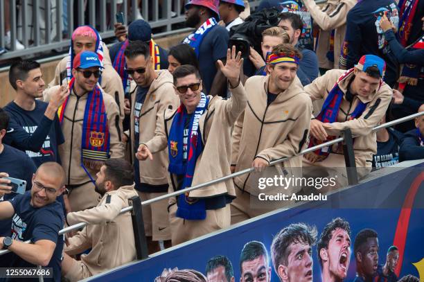 The players of FC Barcelona football team on open-top bus leave Camp Nou Stadium to celebrate La Liga title in Barcelona on May 15, 2023.