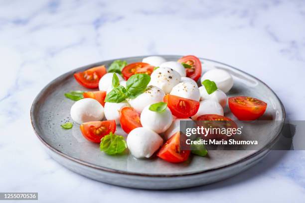 healthy caprese salad - mozzarella stock pictures, royalty-free photos & images