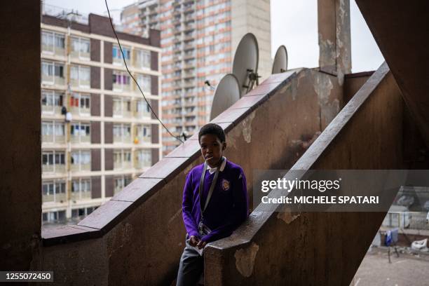 Child walk down the stairs of a hijacked building in Berea, Johannesburg on May 15, 2023. Officials from the city of Johannesburg accompanied by...