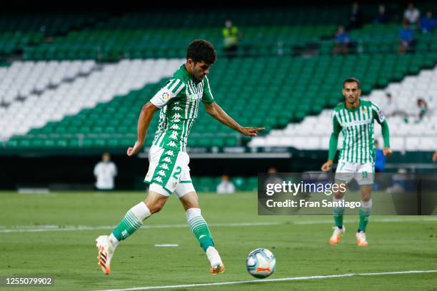 Carles Aleña of Real Betis Balompie scores his team's third goal during the Liga match between Real Betis Balompie and CA Osasuna at Estadio Benito...