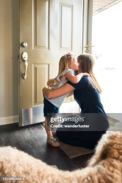 hugging mom goodbye before work - indiana home stock pictures, royalty-free photos & images